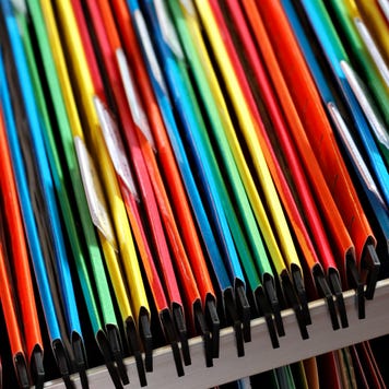 An abstract closeup of multicolored file folders in a filing cabinet