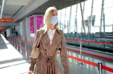 Woman in mask at airport