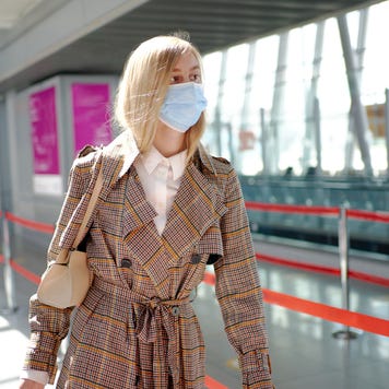 Woman in mask at airport