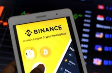 A Binance app appears on a mobile device