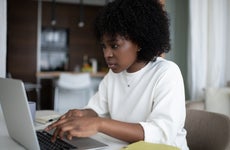 Woman looks at computer