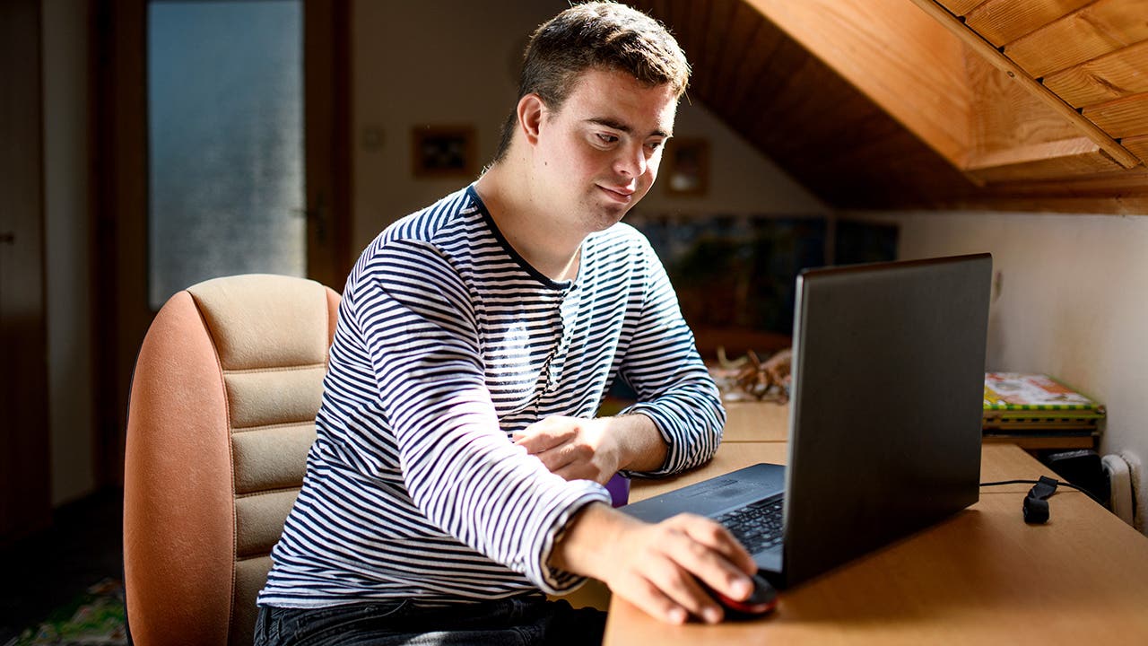 adult with down syndrome using a computer
