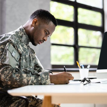 Veteran works at a desk