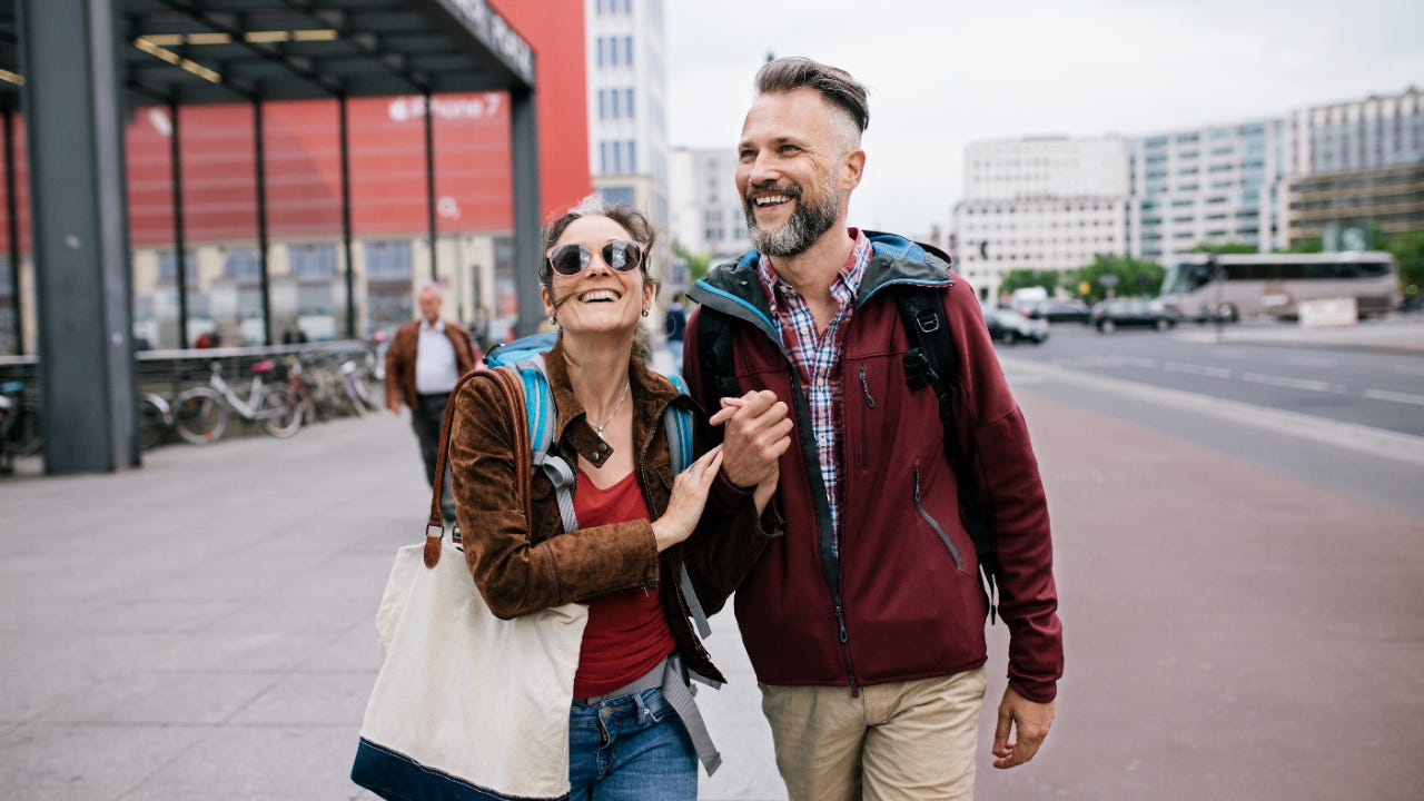 A couple walks through the streets