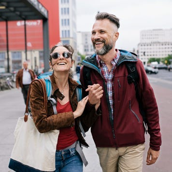 A couple walks through the streets