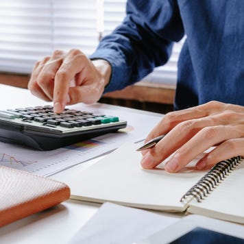 Person uses a calculator