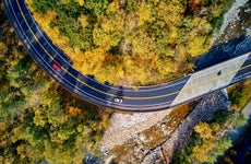 aerial view of cars driving along a winding road