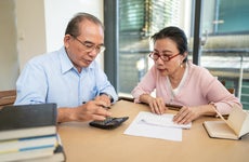 Married senior couple calculating their finances