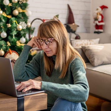 Mature woman shopping online at Christmas