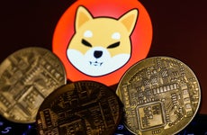 The Shiba Inu logo and some golden cryptocurrency