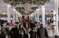 Holiday shoppers gather in Macy's for holiday shopping during the coronavirus pandemic.