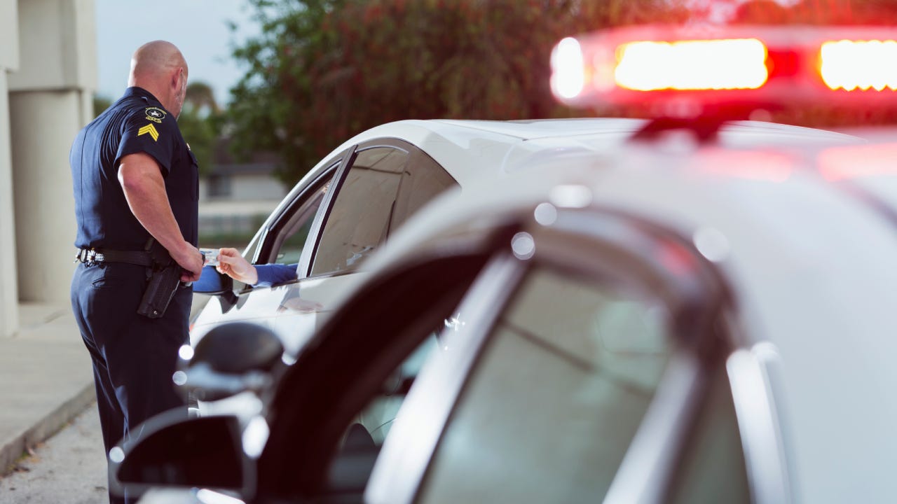 Policeman asking driver for identification