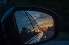 Reflection Of Car In The Sunset On Side-View Mirror