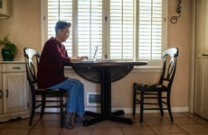 Senior woman using laptop computer at home
