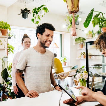 Man Ordering At Quirky Café Counter