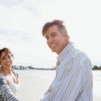 Portrait of smiling mature couple on beach vacation
