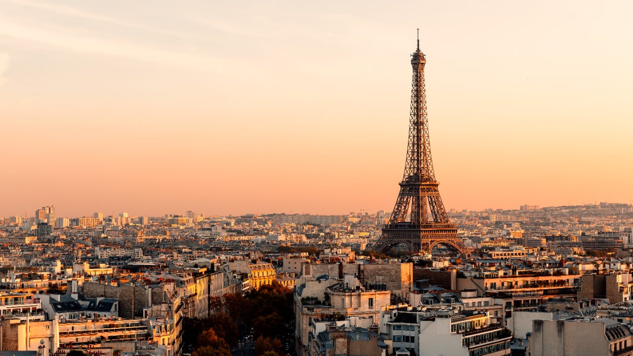 Aerial view of Paris streets and Eiffel Tower at sunset