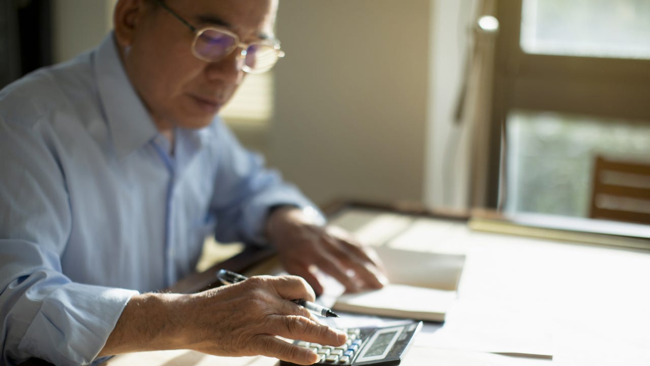 Senior man calculating finances