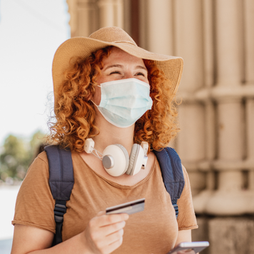 Person traveling with hard-earned credit card rewards