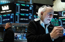A trader watches the market at the New York Stock Exchange