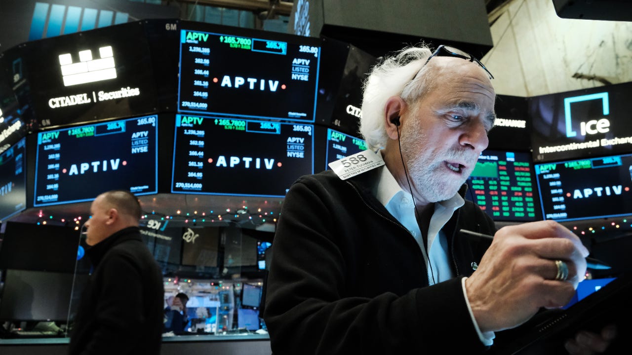 A trader watches the market at the New York Stock Exchange
