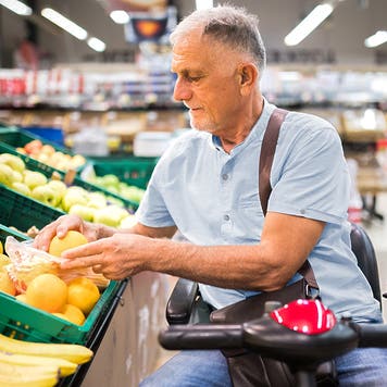 Senior man with a disability in shopping