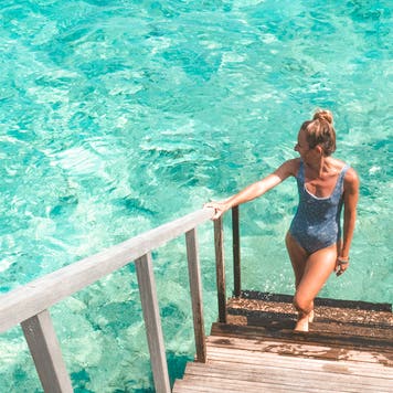 Young woman relaxing in luxury hotel in the Maldives