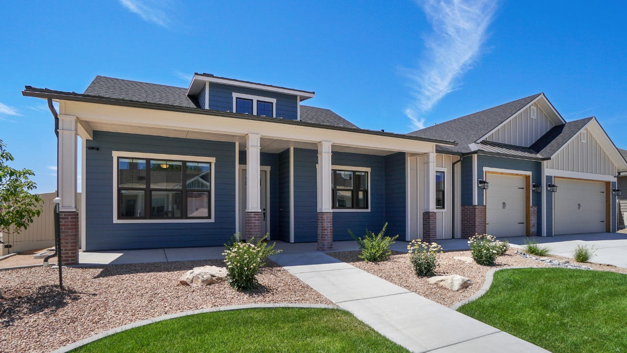 Modern Real Estate Front Exterior Blue and White Color Scheme with landscaping