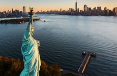 USA, New York State, New York City, Aerial view of Statue of Liberty at sunrise