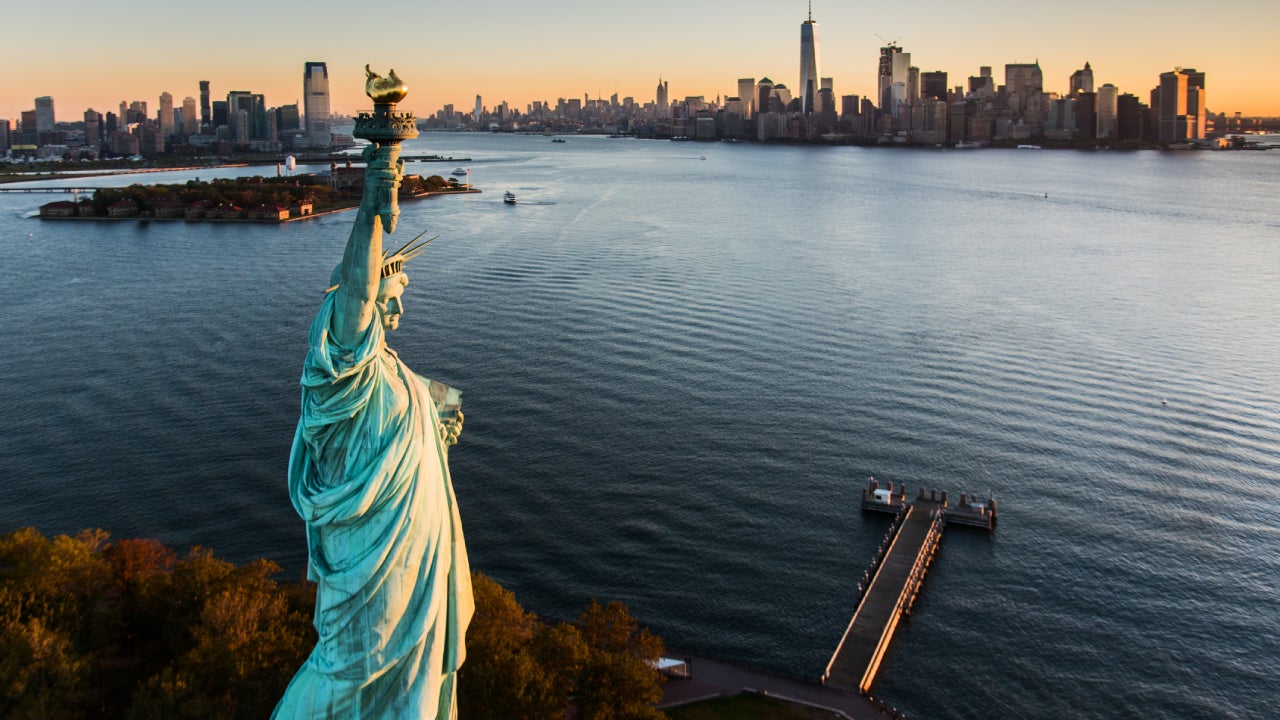 USA, New York State, New York City, Aerial view of Statue of Liberty at sunrise