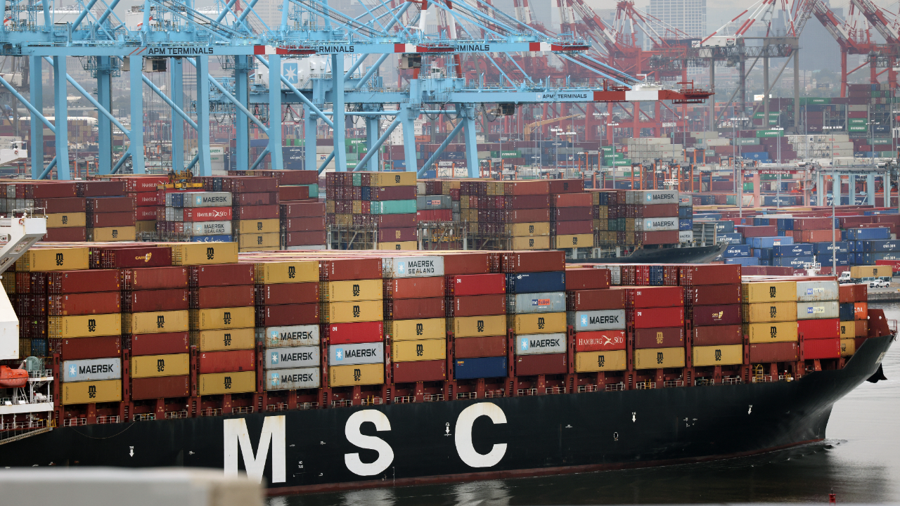 A cargo ship moves towards the Bayonne Bridge as it heads into port in New Jersey