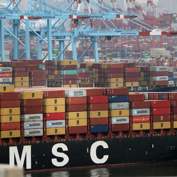 A cargo ship moves towards the Bayonne Bridge as it heads into port in New Jersey