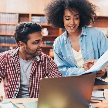 College students collaborating in the library