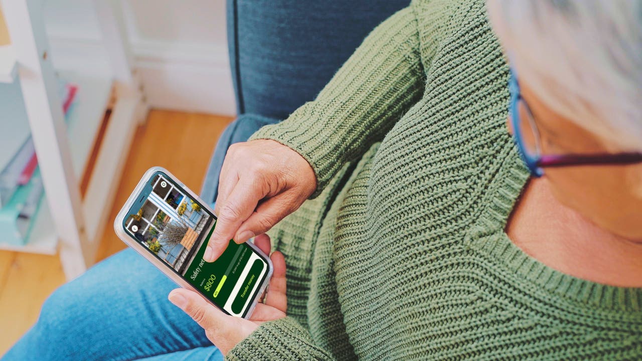 senior woman at home using a smartphone