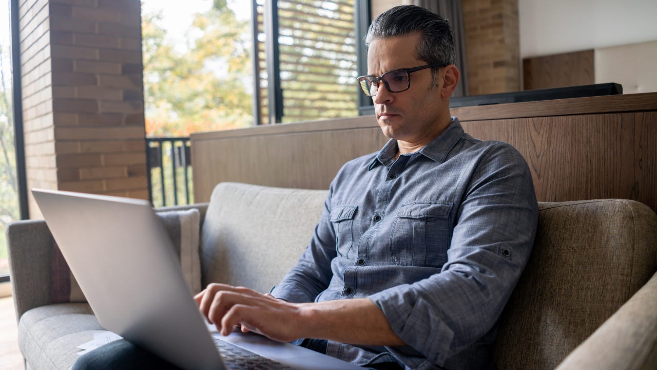 Man working from home on his laptop computer