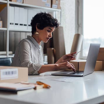 woman doing business at desk