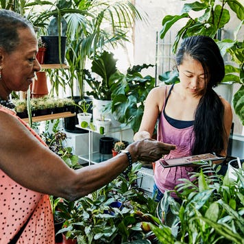 women paying at a plant shop