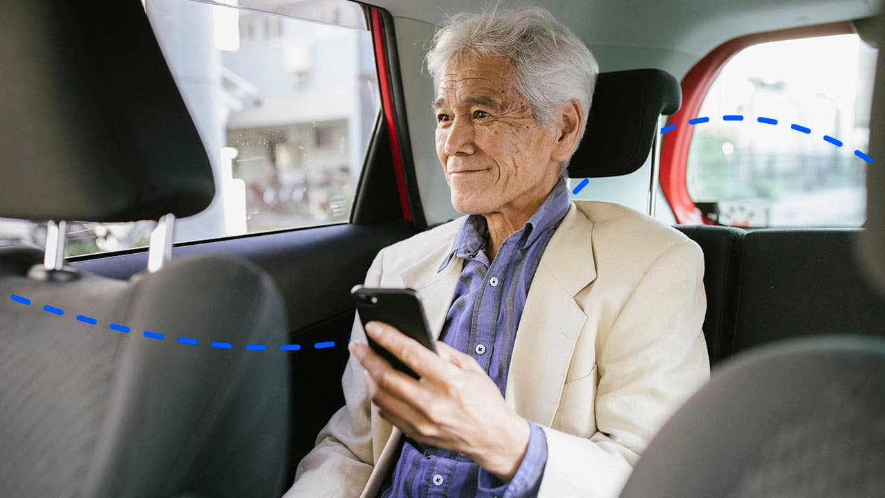 senior man in the backseat of a ride share