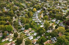 Aerial drone view of American suburban neighborhood during the daytime.