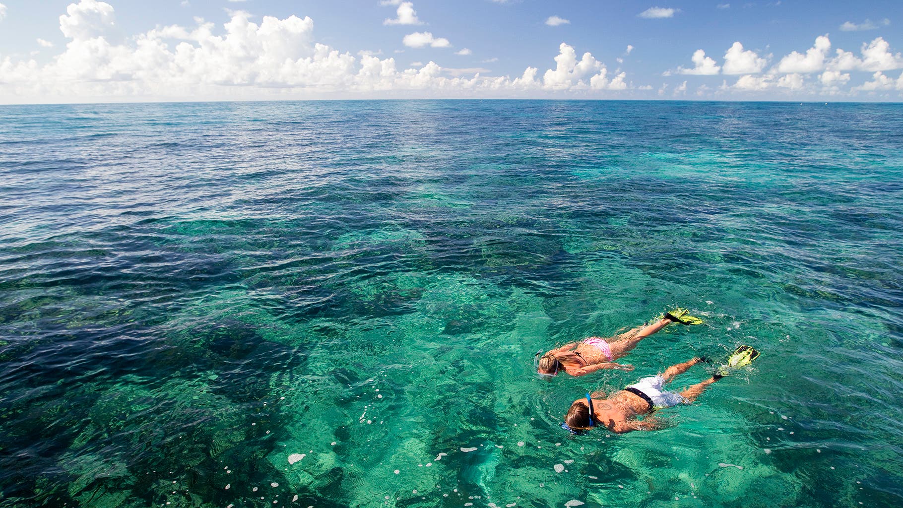 family snorkeling in the ocean