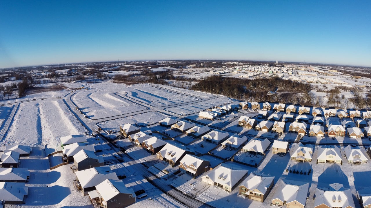 Winter panorama of still developing neighborhood with houses in different stages of building