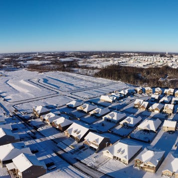 Winter panorama of still developing neighborhood with houses in different stages of building