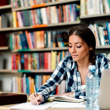 Woman studies in college library