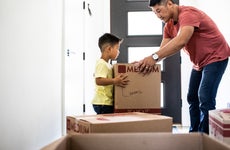 A father and son move into a new home