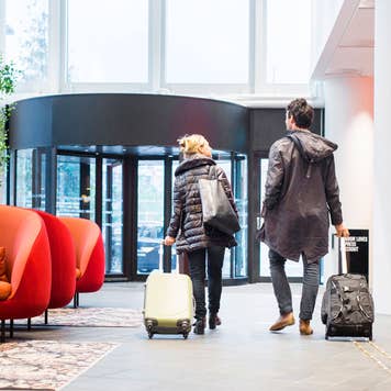 couple walking in hotel lobby