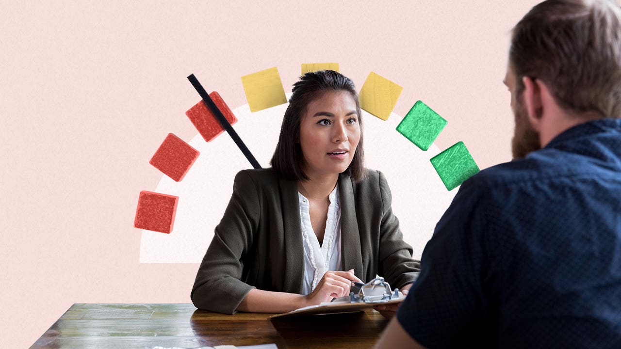 woman with a score range marker behind her speaking to a man