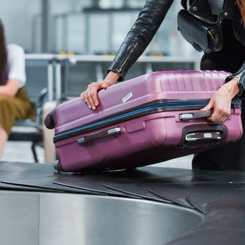 woman grabbing luggage