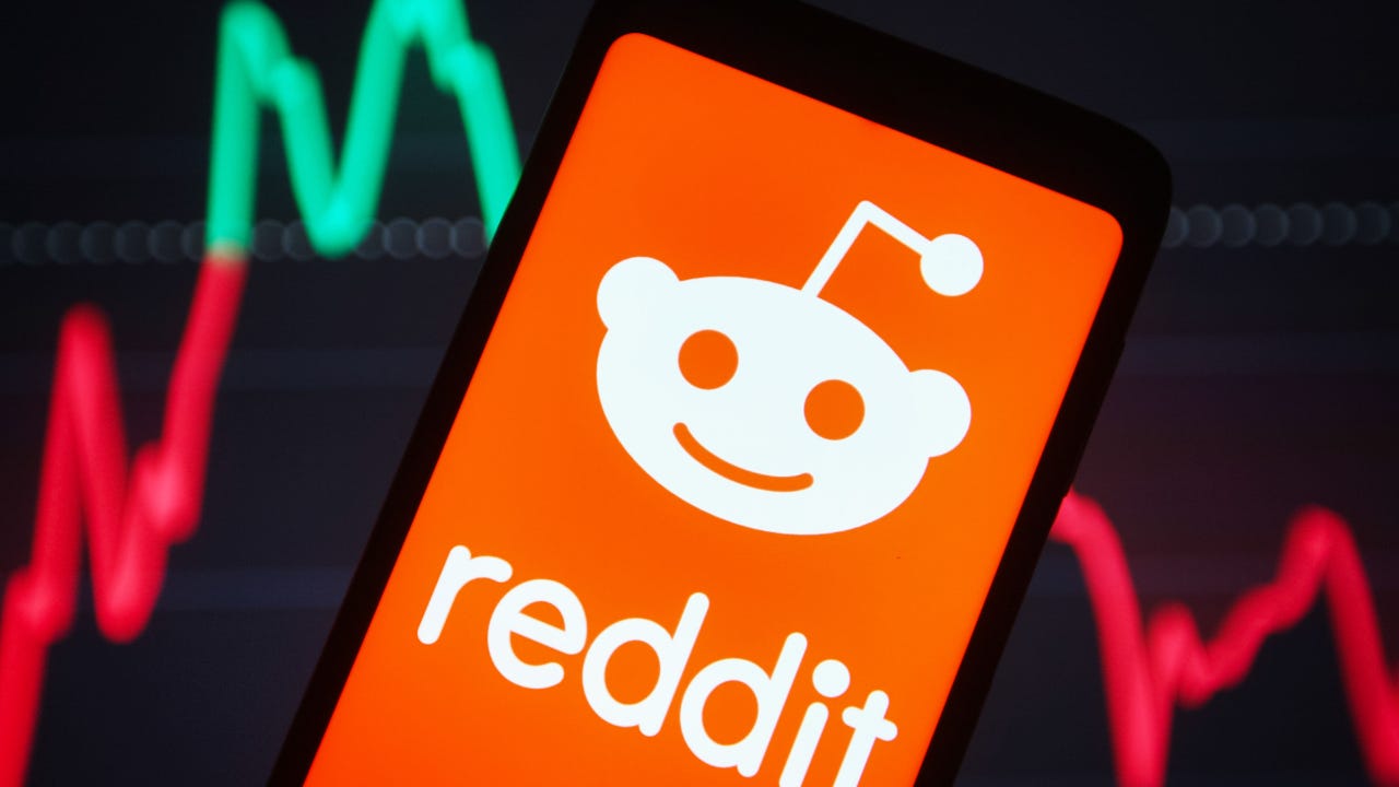 A picture of the Reddit logo on a smartphone