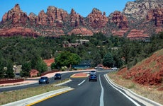 Arizona State Route 179 in Sedona with red rock mountains in the background
