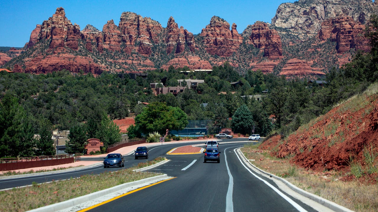 Arizona State Route 179 in Sedona with red rock mountains in the background
